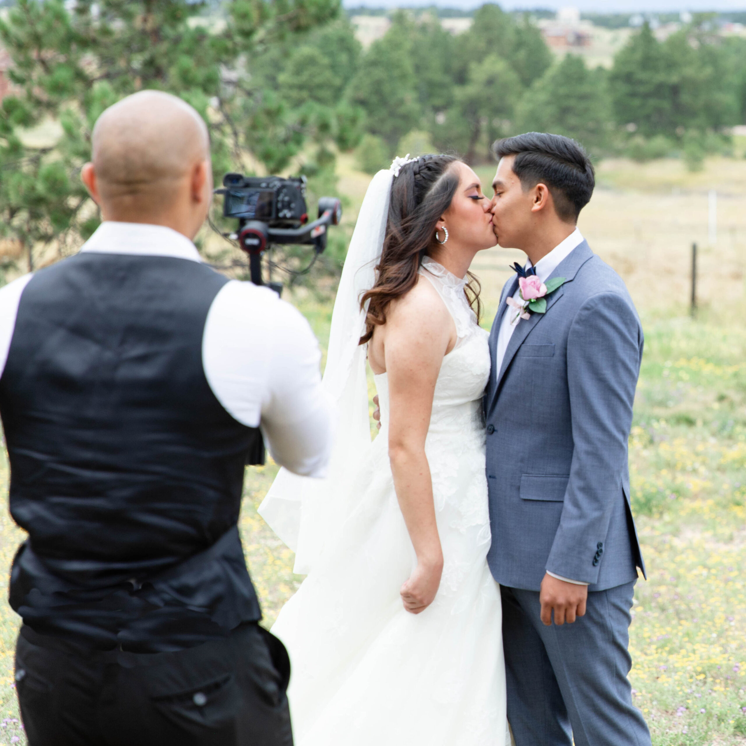 Minneapolis Wedding Videographer filming an outdoor wedding