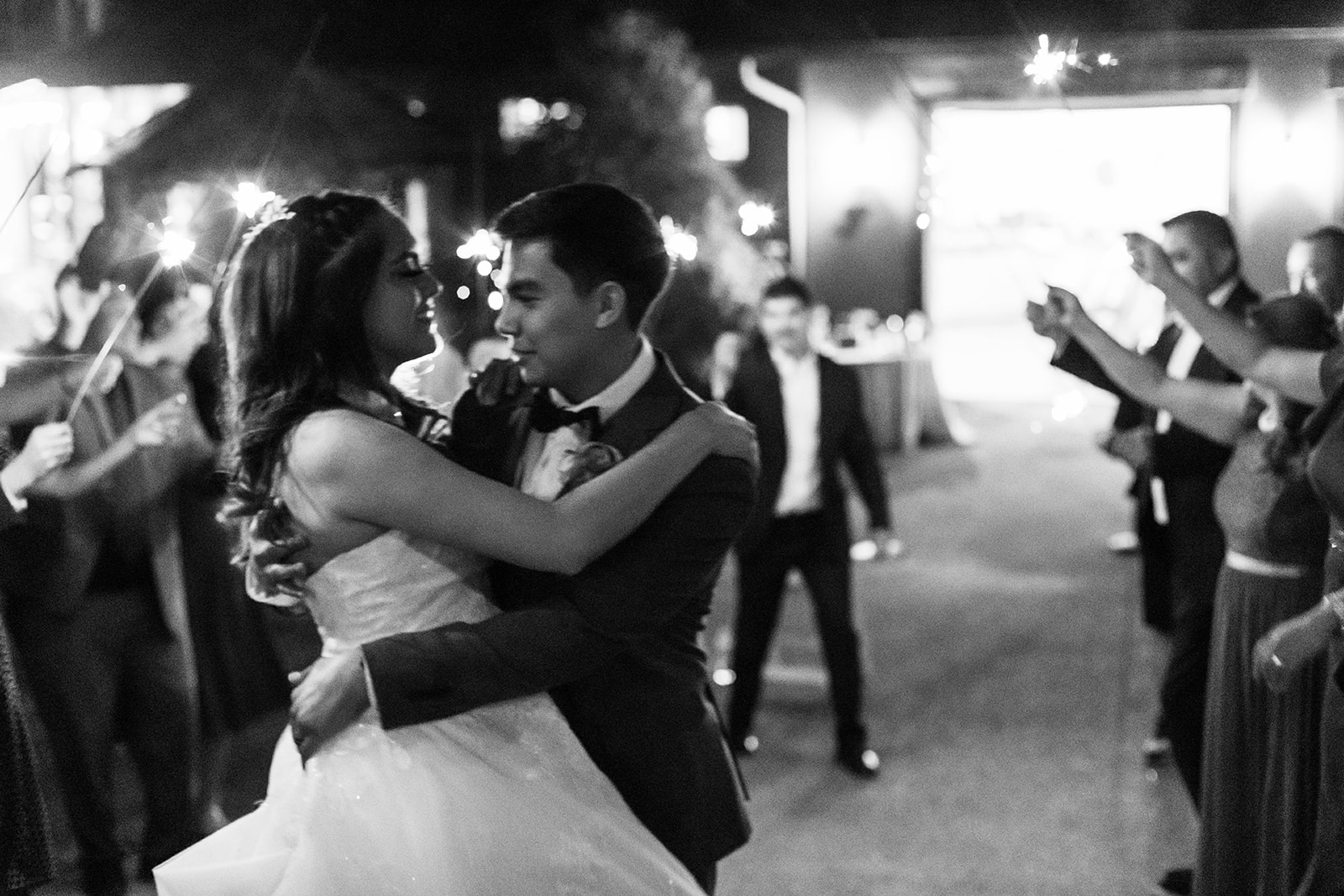 a man and woman dancing at night