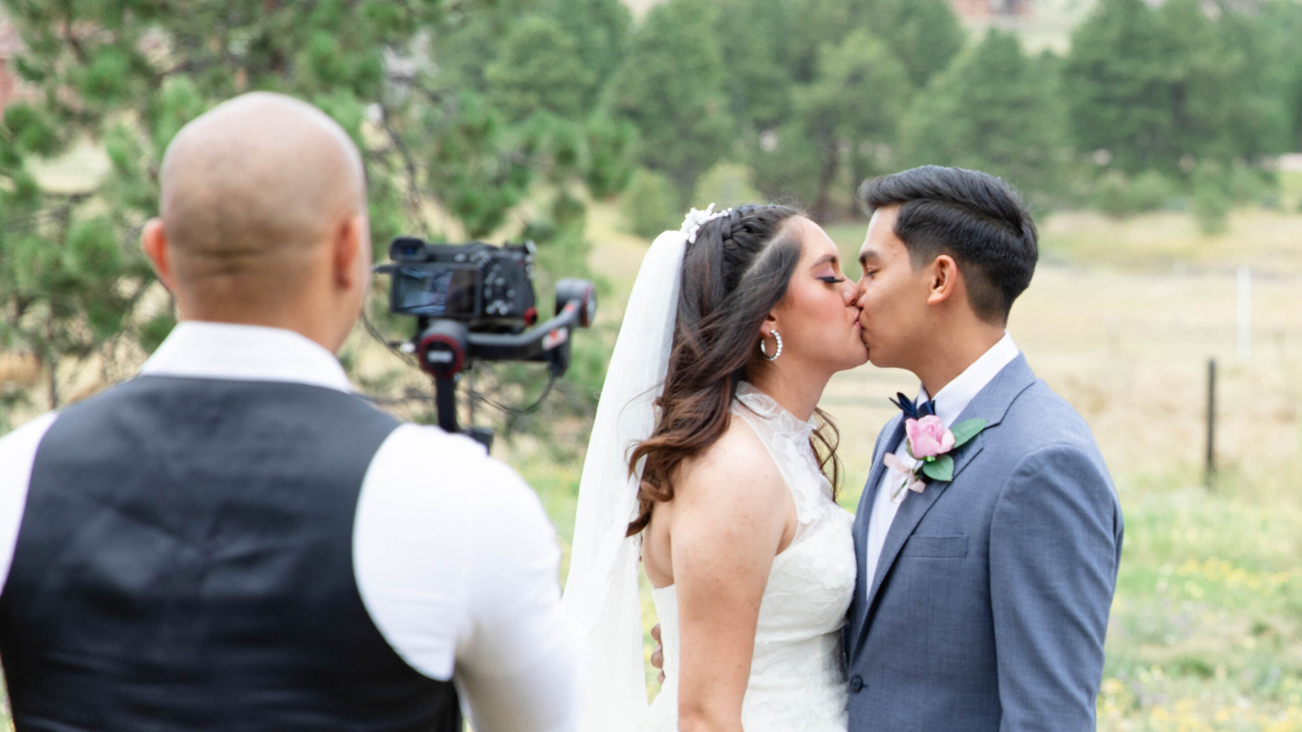 Minneapolis Wedding Videographer filming an outdoor wedding