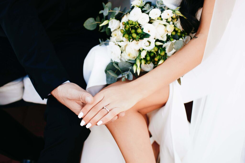 a man and woman holding flowers