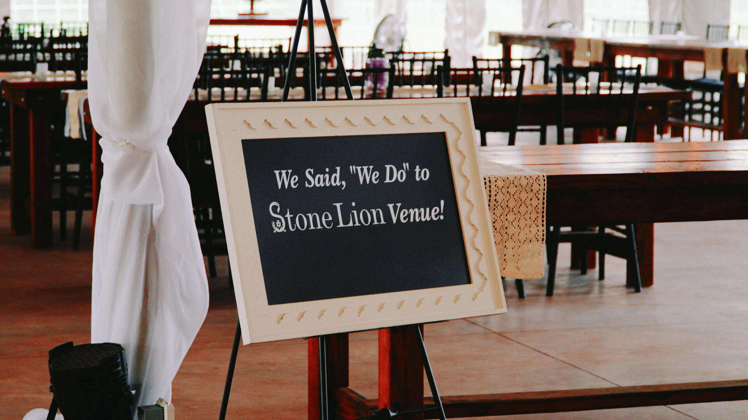 Sign inside a tent venue that says they got married.