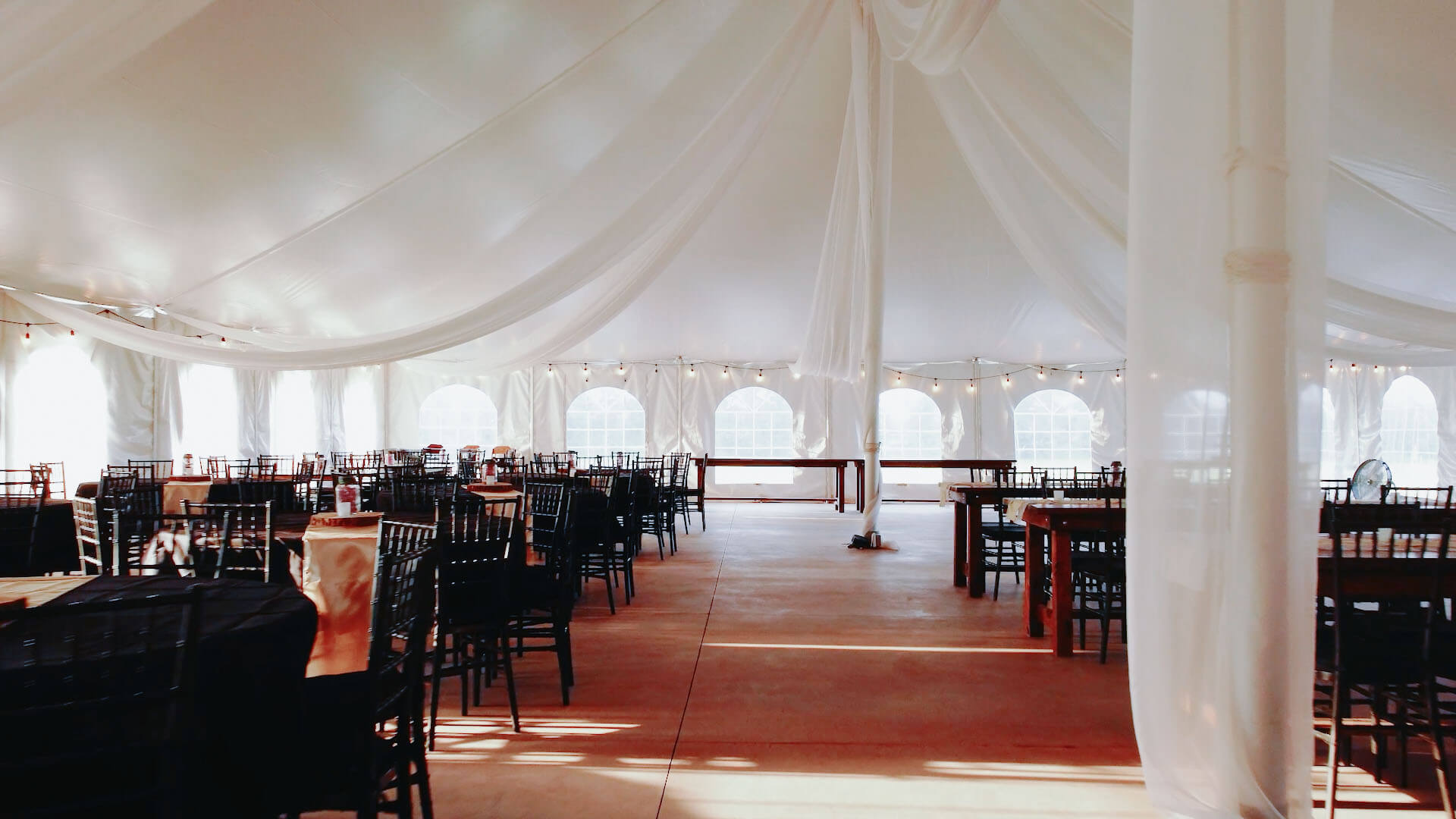 View from inside the tent venue, with tables set up simply but elegantly