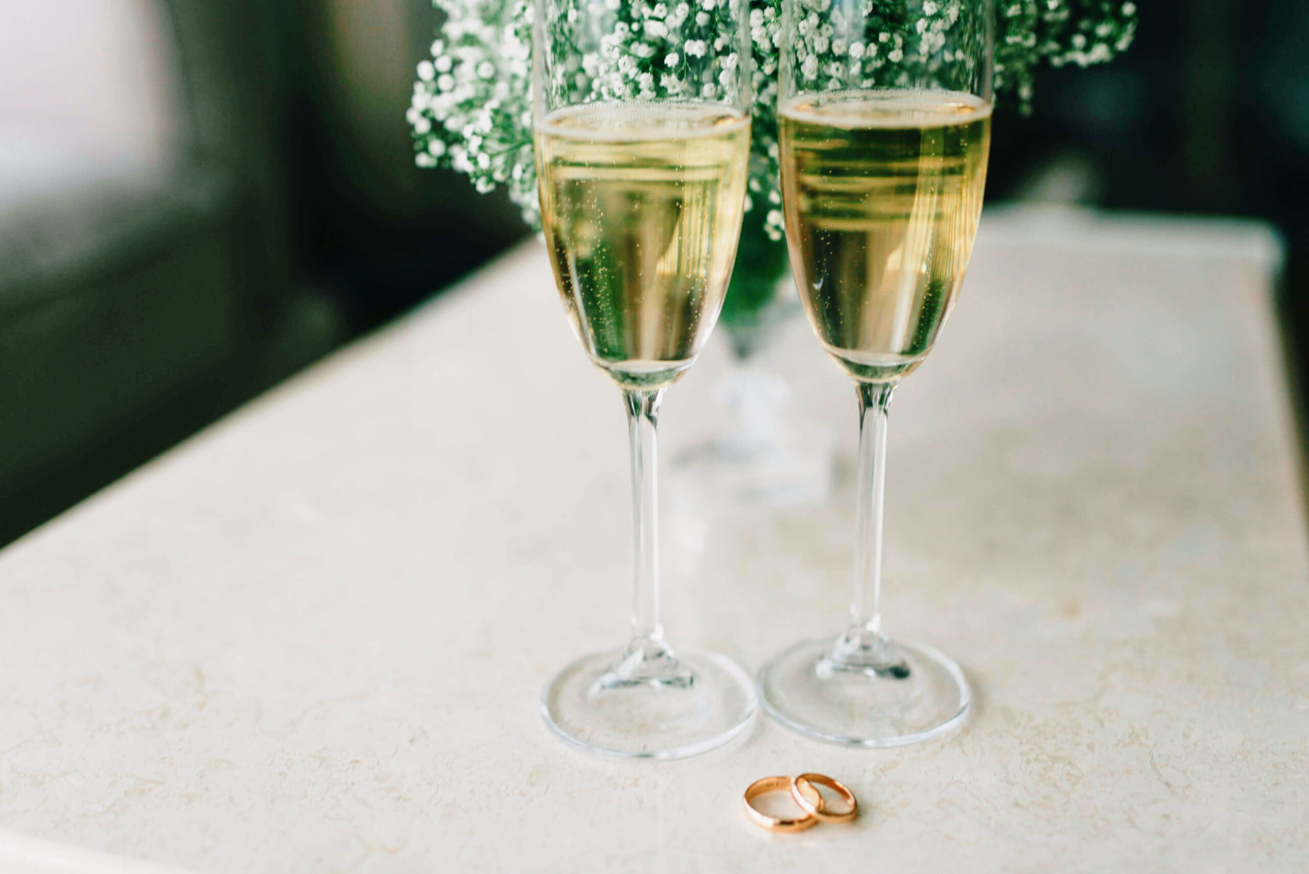 champagne glasses on a table with a white table cloth