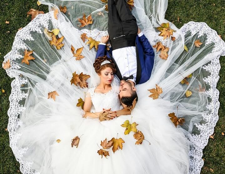 top view of couple laying on ground at a wedding venue in rochester mn